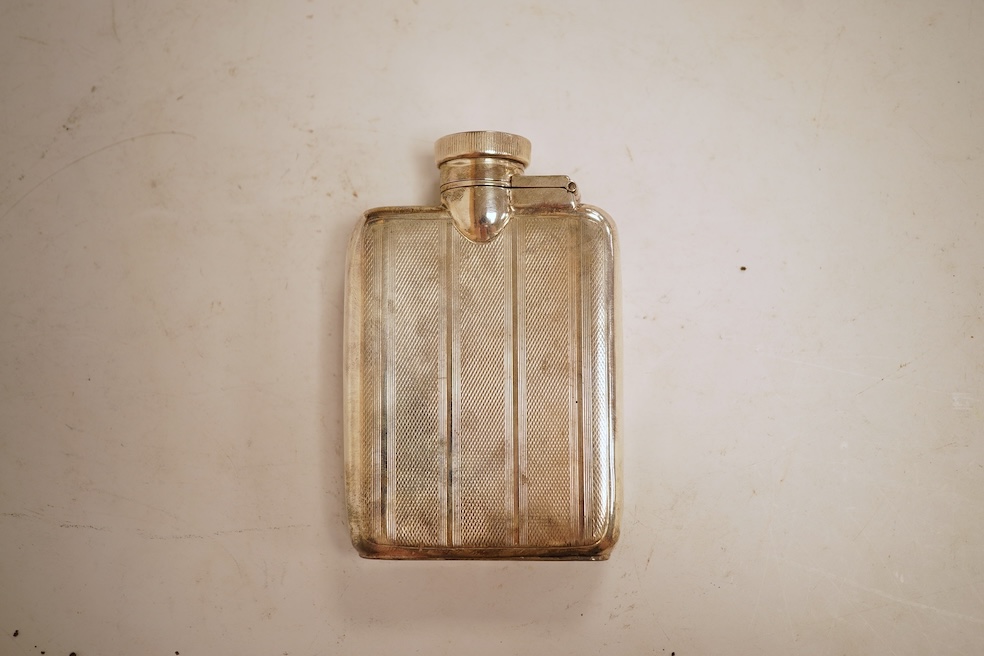 A George V engine turned silver hip flask, William Neale Ltd, Birmingham, 1924, 92mm, 89 grams.